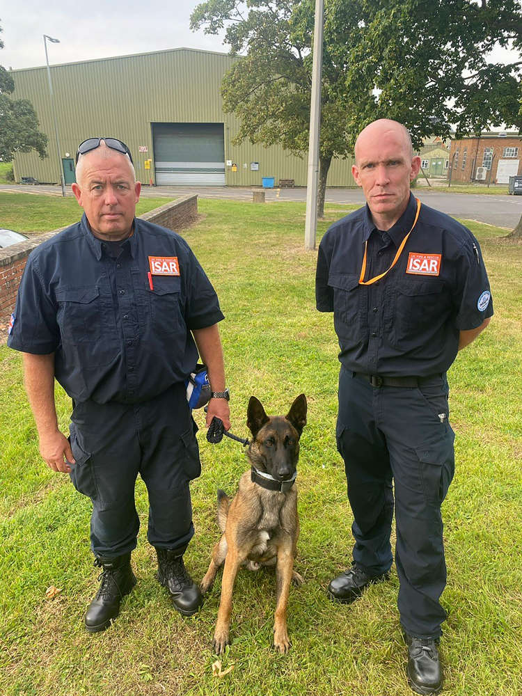 Dog handler and Crew Commander Gary Carroll and Coorie, and Watch Commander Gavin Brown