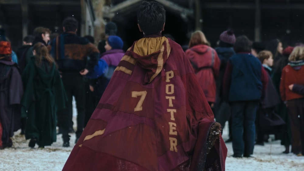 Harry walking in his cloak in the Harry Potter HBO show