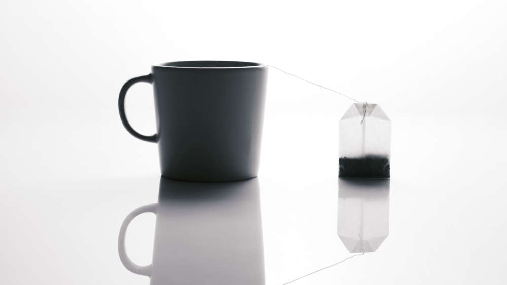 A mug of tea and a tea bag. 