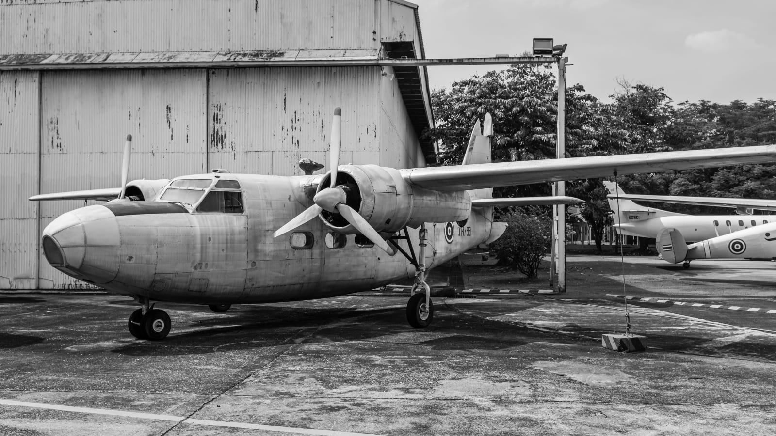 Plane in front of an old air base