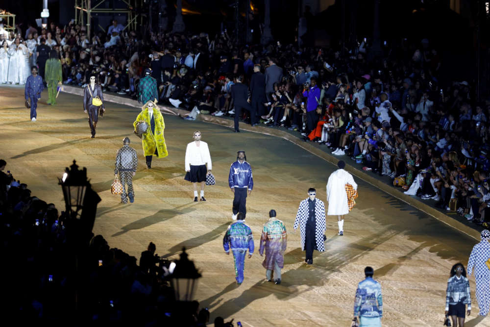 PHERRELL WILLIAMS STAGES LOUIS VUITTON DEBUT ON PONT NEUF - JUST