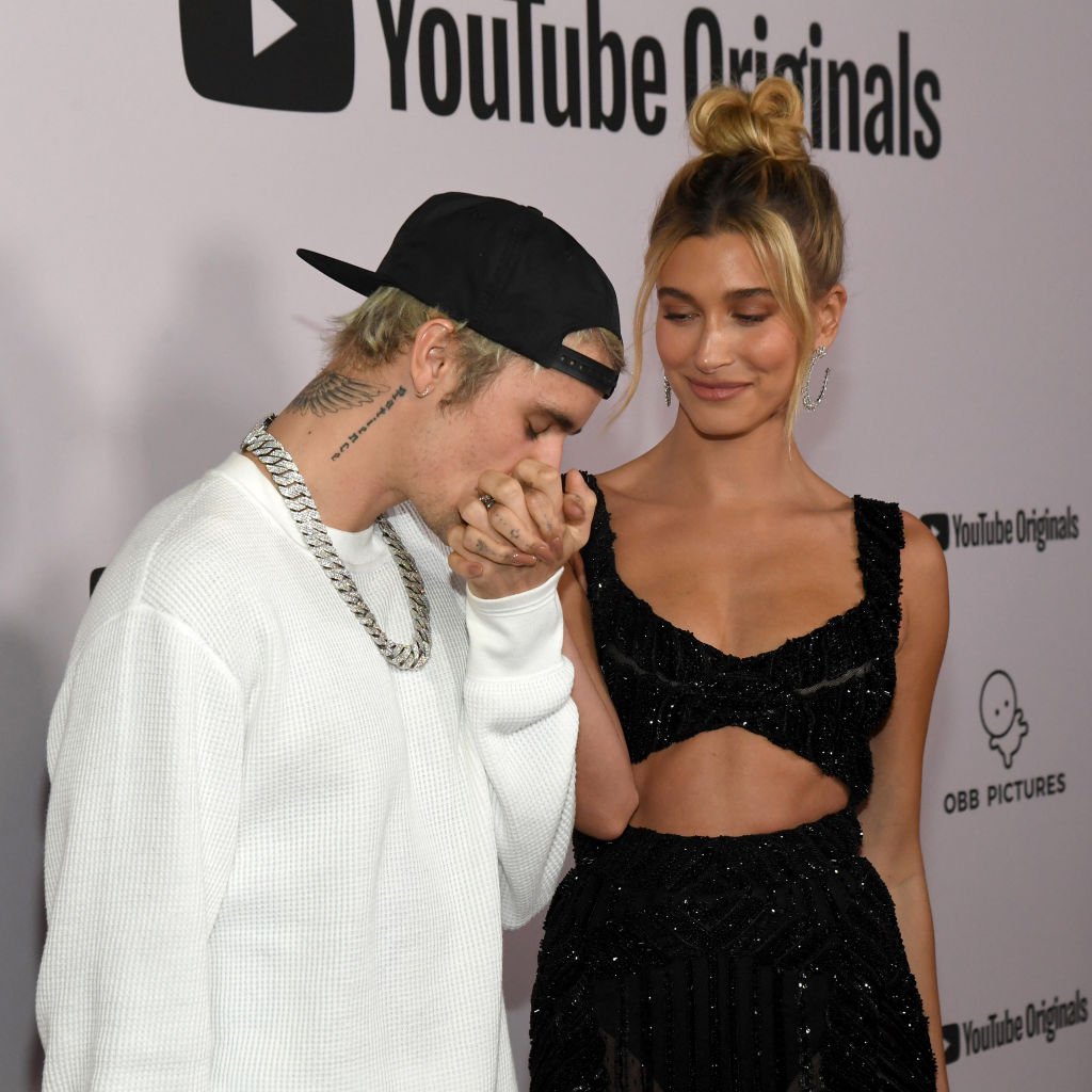 Justin Bieber kisses wife Hailey's hand on the red carpet at the YouTube Originals "Justin Bieber: Seasons" premiere 