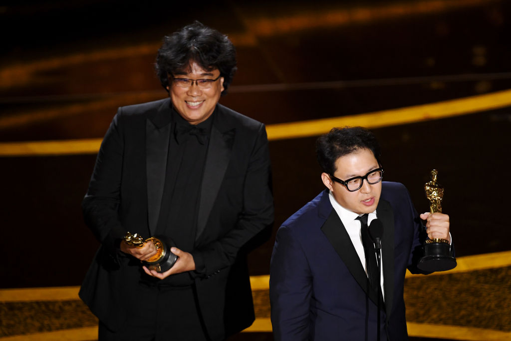 Bong Joon-ho and Han Jin-won accept the award for Original Screenplay 