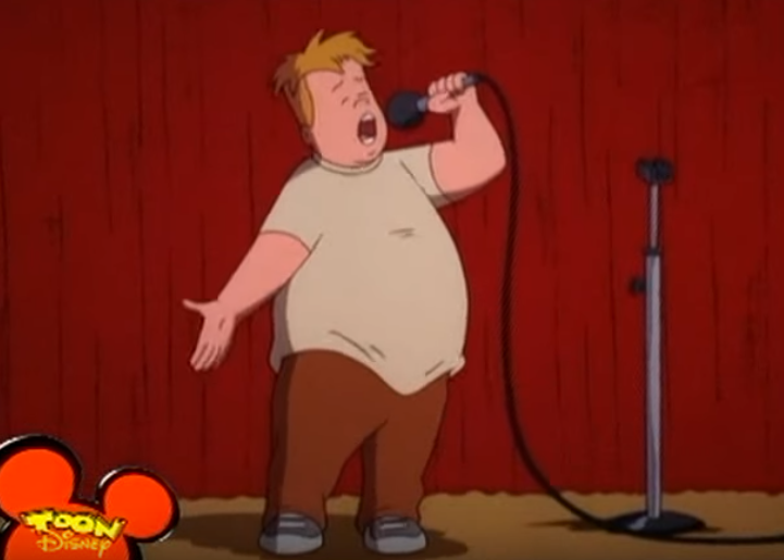 A scene from Recess where Mikey comes out of his shell and sings on stage. 