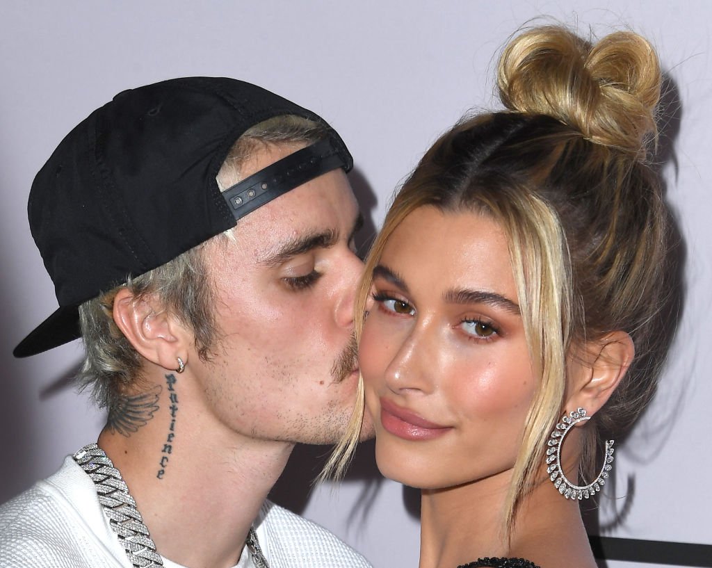 Justin Bieber kisses wife Hailey Bieber on the cheek as they appear on the red carpet at the Premiere Of YouTube Originals' "Justin Bieber: Seasons"