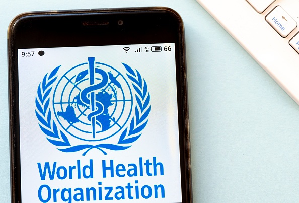 KIEV, UKRAINE - 2020/03/16: In this photo illustration the World Health Organization logo is seen displayed on a smartphone. (Photo Illustration by Igor Golovniov/SOPA Images/LightRocket via Getty Images)