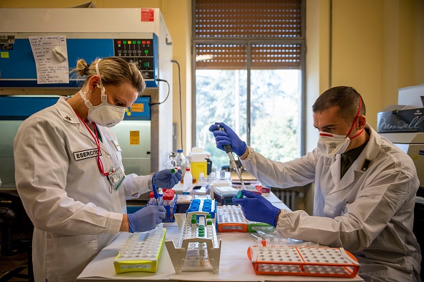 ROME, ITALY - APRIL 1: Italian army doctors work at the chemical analysis laboratory of the scientific department of the Celio Military Polyclinic Hospital (Policlinico Militare Celio) where the Coronavirus (COVID-19) genome was sequenced, on April 1, 2020, in Rome, Italy. The Italian government continues to enforce the nationwide lockdown measures to control the spread of COVID-19. (Photo by Antonio Masiello/Getty Images)