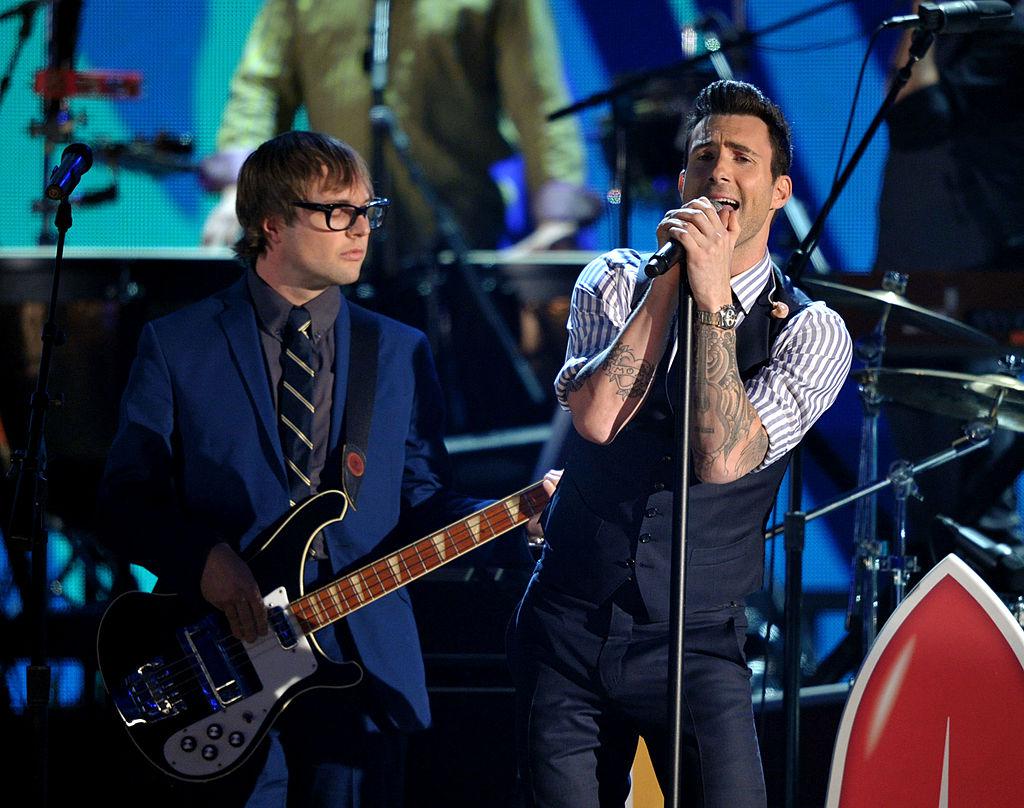 Mickey Madden on stage with Adam Lavigne