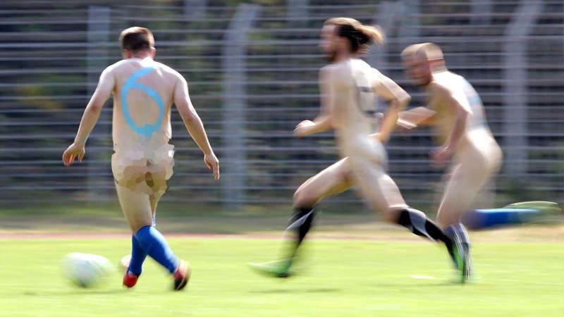 Flying tackles and high balls…Germany's naked football team takes to field