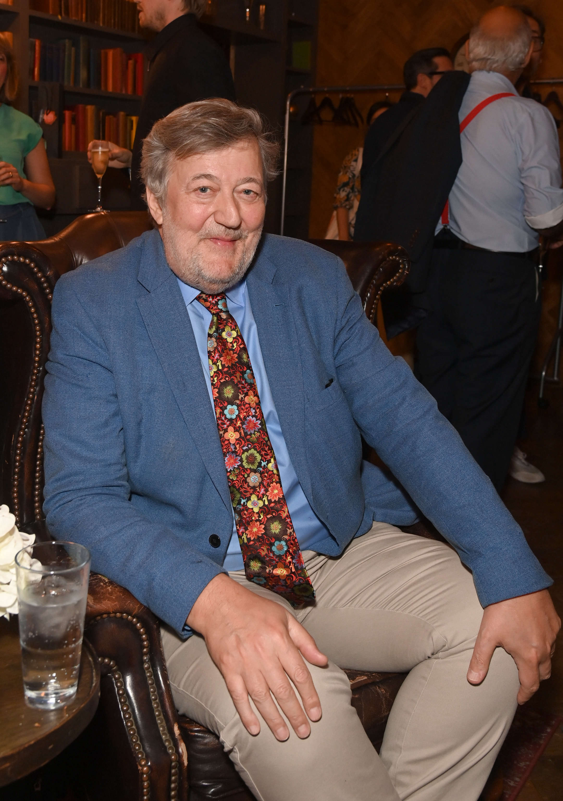 Stephen Fry falls six feet off stage, taken to hospital for