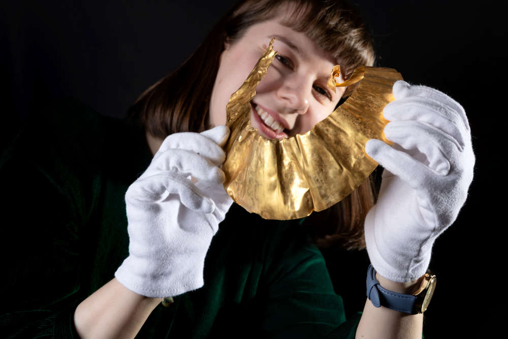 Craven Museum curator, Charlotte Craig, with the gold lunula which has gone on permanent display in Skipton.