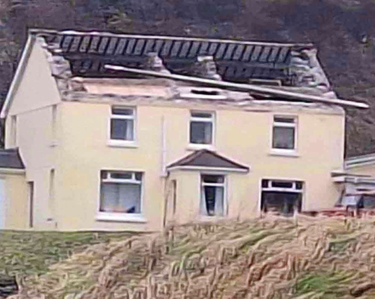 Image of the property with a damaged roof and the building's interior on display